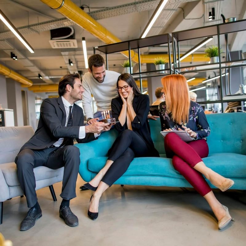 birthday-party-for-the-young-female-colleague-in-the-office-with-the-small-cake.jpg